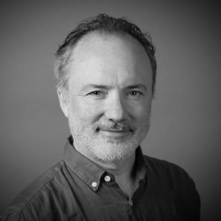 A black and white photo of Tim Webber