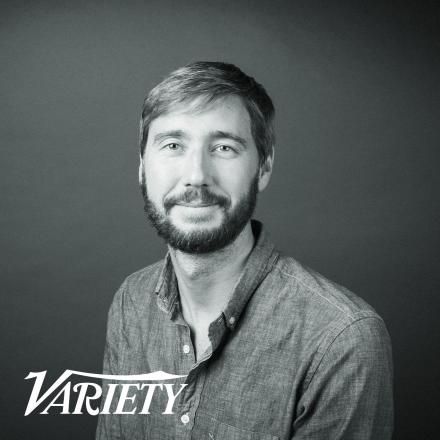 A headshot of Theo Jones Creative Director of AI at Framestore with a white Variety logo in the bottom left corner.